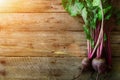 Bunch of fresh organic beetroot on wooden background. Concept of diet, raw, vegetarian meal. Farm, rustic and country Royalty Free Stock Photo