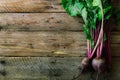 Bunch of fresh organic beetroot on wooden background. Concept of diet, raw, vegetarian meal. Farm, rustic and country Royalty Free Stock Photo