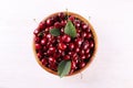 Bunch of fresh organic sweet cherries on textured background. Clean eating concept. Healthy nutritious vegan snack, raw diet. Royalty Free Stock Photo