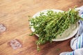 Bunch of fresh organic thyme on a wooden