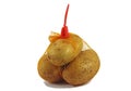 Bunch fresh potatoes in a orange mesh bag Royalty Free Stock Photo