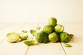 Bunch of fresh raw Brussel sprouts on a white wood table Royalty Free Stock Photo