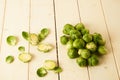 Bunch of fresh raw Brussel sprouts on a white wood table Royalty Free Stock Photo