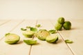 Bunch of fresh raw Brussel sprouts on a white wood table Royalty Free Stock Photo