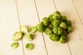 Bunch of fresh raw Brussel sprouts on a white wood table Royalty Free Stock Photo