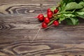 Bunch of fresh red radish, on wooden table Royalty Free Stock Photo