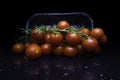 Bunch of fresh, red tomatoes with green stems cherry tomatoes on dark background Royalty Free Stock Photo