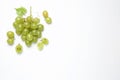 Bunch of fresh ripe green grapes with leaf on white background, top view Royalty Free Stock Photo