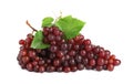 Bunch of fresh ripe juicy red grapes with leaves isolated on white Royalty Free Stock Photo