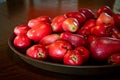 Bunch of fresh ripe red skin Jamaican Otaheite apples. Popular tangy flavor fruit in Jamaica & the Caribbean culture.