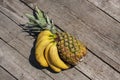 Bunch of fresh ripe yellow bananas and big ripe sweet pineapple Royalty Free Stock Photo