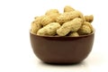 A bunch of fresh roasted peanuts in a brown bowl Royalty Free Stock Photo