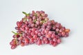 bunch of fresh seedless red grapes isolated on white background Royalty Free Stock Photo