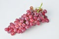 bunch of fresh seedless red grapes isolated on white background Royalty Free Stock Photo