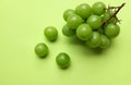 bunch of fresh sweet green shine muscat (vitis vinifera) grape and leaf isolate on green background Royalty Free Stock Photo