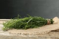 Bunch of fresh tarragon sprigs on wooden table Royalty Free Stock Photo