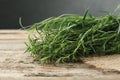 Bunch of fresh tarragon sprigs on wooden table, closeup Royalty Free Stock Photo