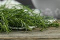 Bunch of fresh tarragon sprigs on wooden table, closeup Royalty Free Stock Photo
