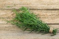 Bunch of fresh tarragon on wooden table Royalty Free Stock Photo