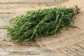 Bunch of fresh tarragon on wooden table, closeup Royalty Free Stock Photo