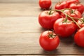 Bunch of fresh tomatoes on grey background. Harvesting tomatoes. Space for text Royalty Free Stock Photo