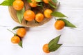 Mandarin Oranges on rustic white wooden background