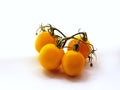 Bunch of fresh yellow tomatoes isolated on white background. Close up Royalty Free Stock Photo