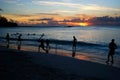 Bunch of friends playing cricket at the beach in Barbados Royalty Free Stock Photo