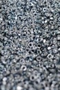 Bunch of galvanized hexagon nuts for bolts for fasten multiple parts together, hardware fasteners Royalty Free Stock Photo