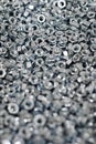 Bunch of galvanized hexagon nuts for bolts for fasten multiple parts together, hardware fasteners Royalty Free Stock Photo