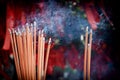 A bunch of glowing incense sticks