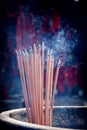 A bunch of glowing incense sticks