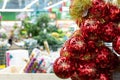 A bunch of glowing red balls with golden snowflakes, christmas sale concept. Blurred background backdrop design, christmas