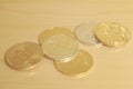 Bitcoin Ethereum golden coins on table many