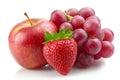 A bunch of grapes and an apple with a strawberry on top Royalty Free Stock Photo