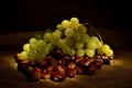 Bunch of grapes on a bed of chestnuts Royalty Free Stock Photo