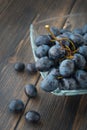 A bunch of grapes - black Spanish grape - in a glass bowl