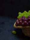 A bunch of grapes from karzina on a black background