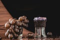 Bunch of grapes next to a chocolate cupcake on a  black and wooden background Royalty Free Stock Photo