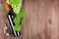 Bunch of grapes, red wine and corkscew Royalty Free Stock Photo