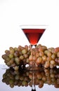 A bunch of grapes and wine in a glass Royalty Free Stock Photo