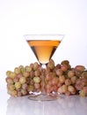 A bunch of grapes and wine in a glass Royalty Free Stock Photo