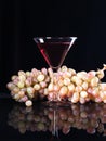 A bunch of grapes and wine in a glass Royalty Free Stock Photo