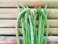 Bunch of Green Beans on Bamboo Surface