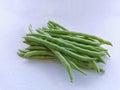 Bunch of green beans on white background. Selective focus. Royalty Free Stock Photo