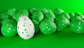 Bunch of Easter eggs with dot paintings, green and white colors