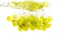 Bunch of green grapes sinking into crystal clear water