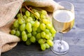 Bunch green grapes and wine on wooden background Royalty Free Stock Photo