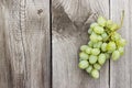 Bunch of green grapes on wooden background Royalty Free Stock Photo