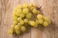 Bunch green grapes on wooden background Royalty Free Stock Photo